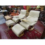 Pair of original 'Stressless' easy chairs with leg rests, paperwork and 1 with food tray