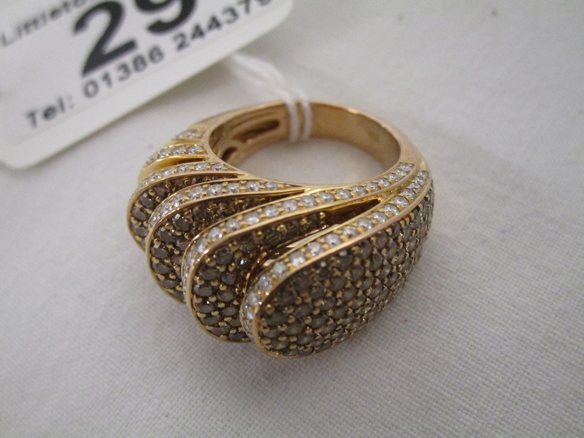 Unusual 18ct pink gold ring set with many diamonds