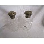 2 Victorian cut glass scent bottles with silver tops