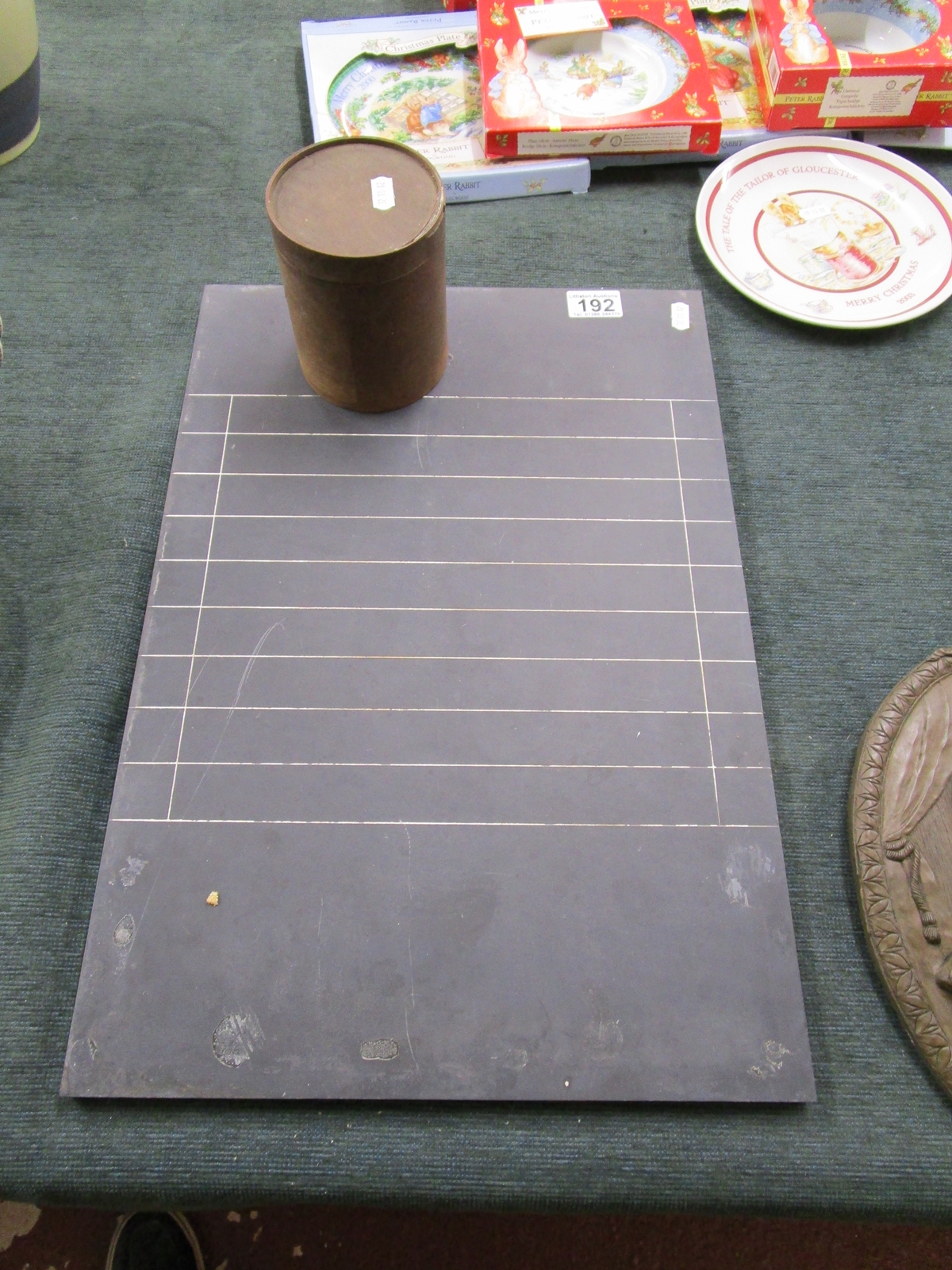 Slate 'shove halfpenny board' and container of counters