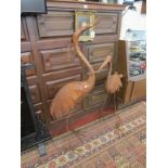 Pair of large metal stork sculptures