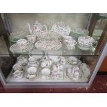 Wedgwood and Minton dinner sets over 2 shelves