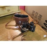 Small binoculars with leather case