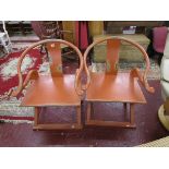 Pair of unusual Oriental themed horseshoe armchairs