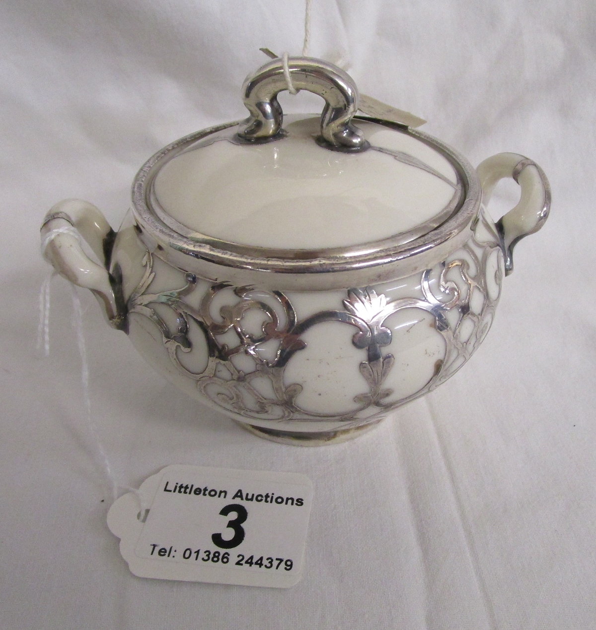 Fine porcelain and silver mounted sugar bowl