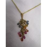 Multi-coloured sapphire pendant on gold chain