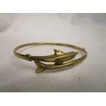 Gold dolphin bangle