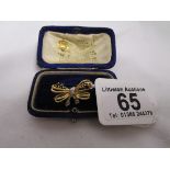 Gold diamond and sapphire bow brooch