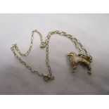 Gold poodle on chain