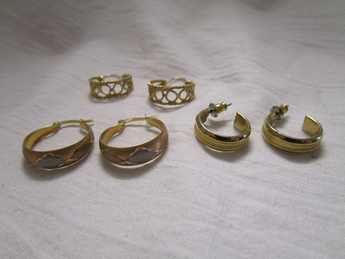 2 pairs of gold earrings and another