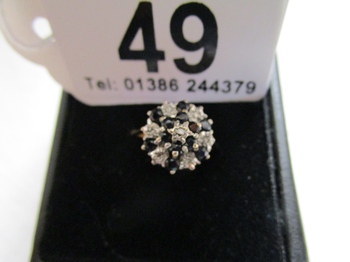 Gold diamond and sapphire cluster ring