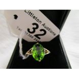 Green stone set gold ring