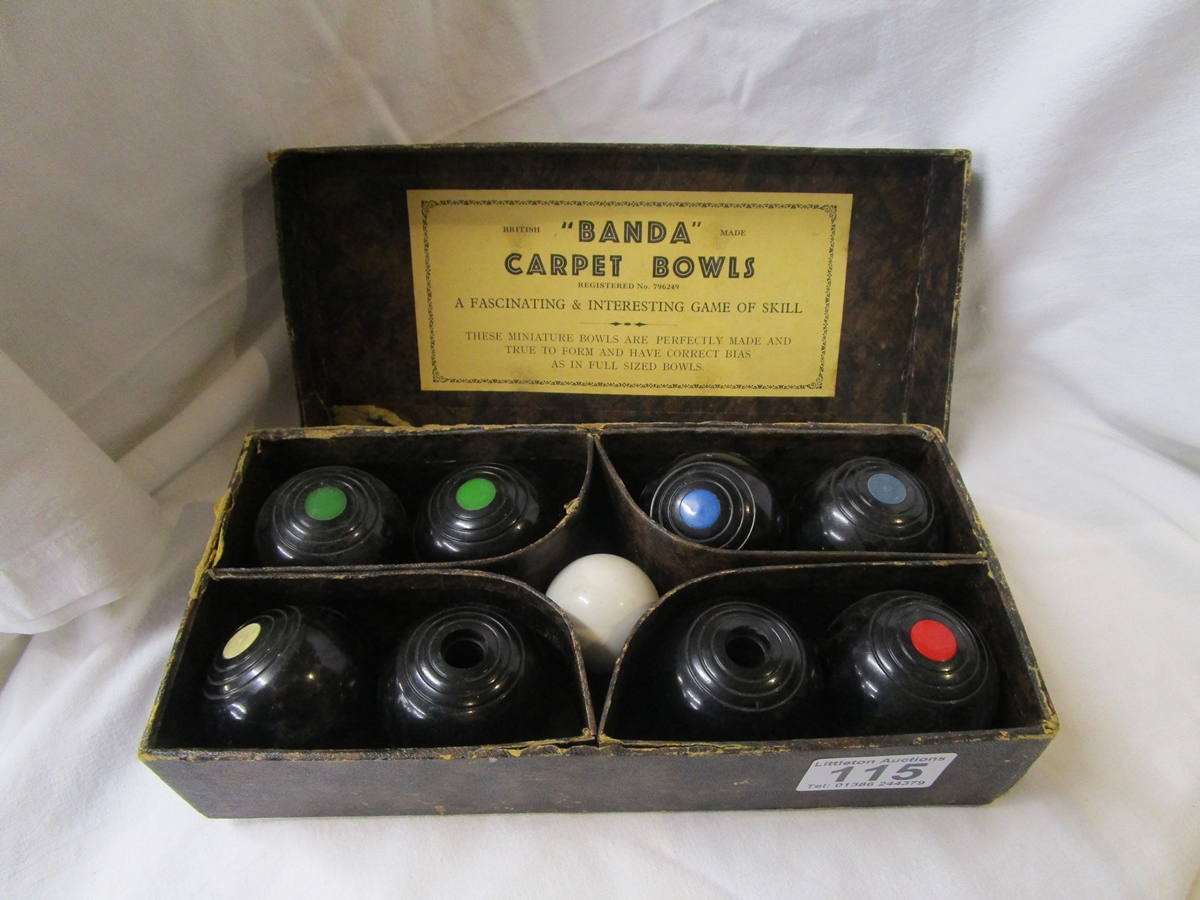 Cased set of carpet bowls