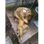 Stone cherub wall pocket