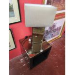 Modern mirror-top table and matching table lamp