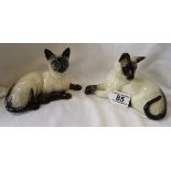 Pair of reclining Royal Doulton cats