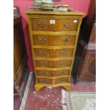 Yew wood serpentine fronted chest of 6 drawers