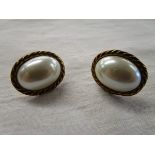 Pair of gold pearl earrings