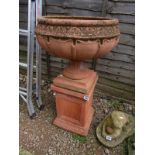 Terracotta urn on plinth