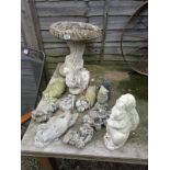 Collection of stone animal garden figures and bird bath