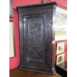 Small carved corner cupboard