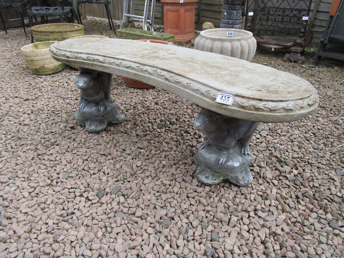 Stone curved otter themed bench