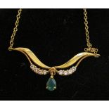 Gold emerald pendant on chain