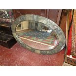 Bevelled glass oval mirror with metal frame