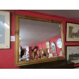 Pine framed and bevelled glass wall mirror