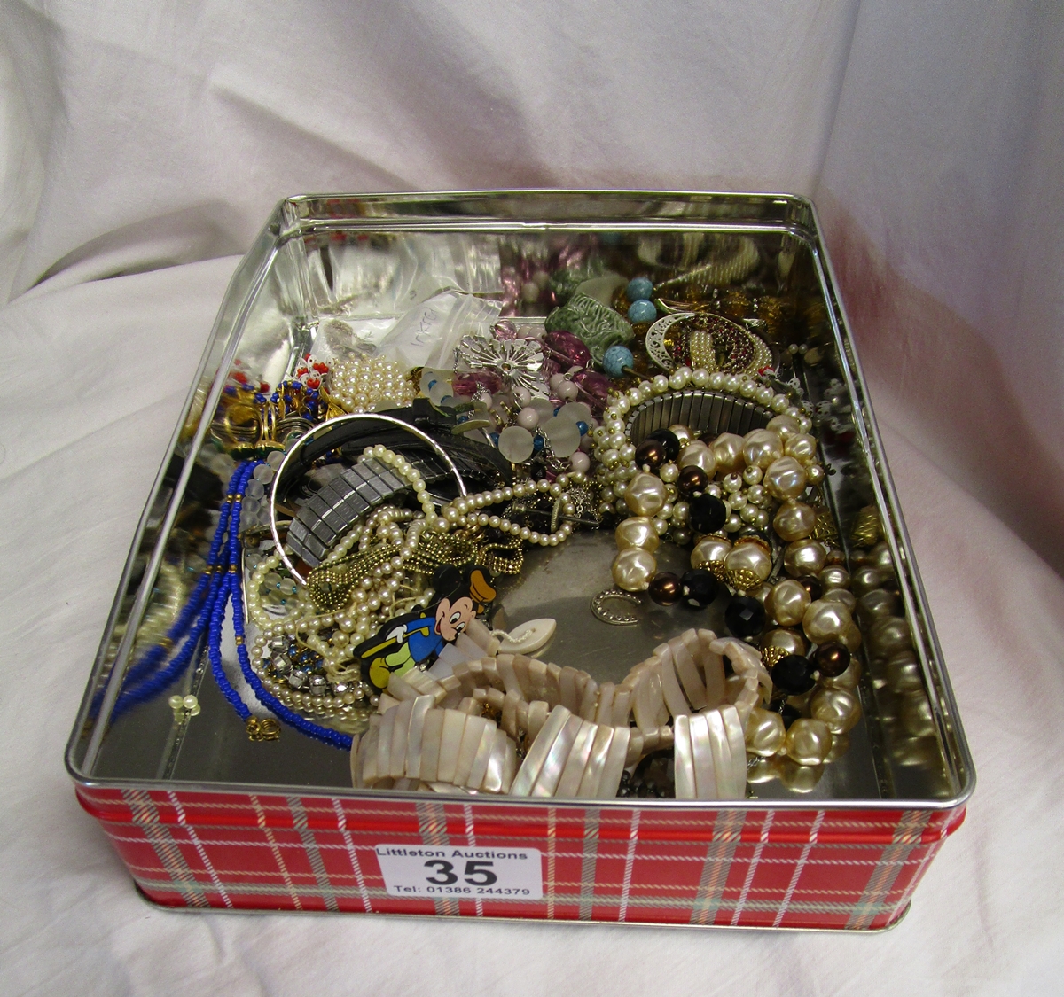 Tin of vintage costume jewellery & silver items