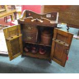 Carved oak smokers cabinet to include pipes and other accessories