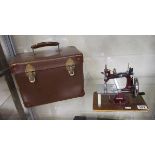 Miniature sewing machine with case