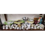 Shelf of ceramics to include miniature tea cups, musical Toby jug etc