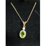 Peridot & diamond pendant on gold chain