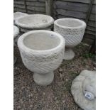 Pair of stone Mayan Urns - circular planters decorated with Aztec designs on circular bases