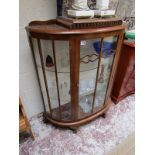 Glass fronted walnut display cabinet with light