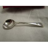 Small silver spoon inset with diamond