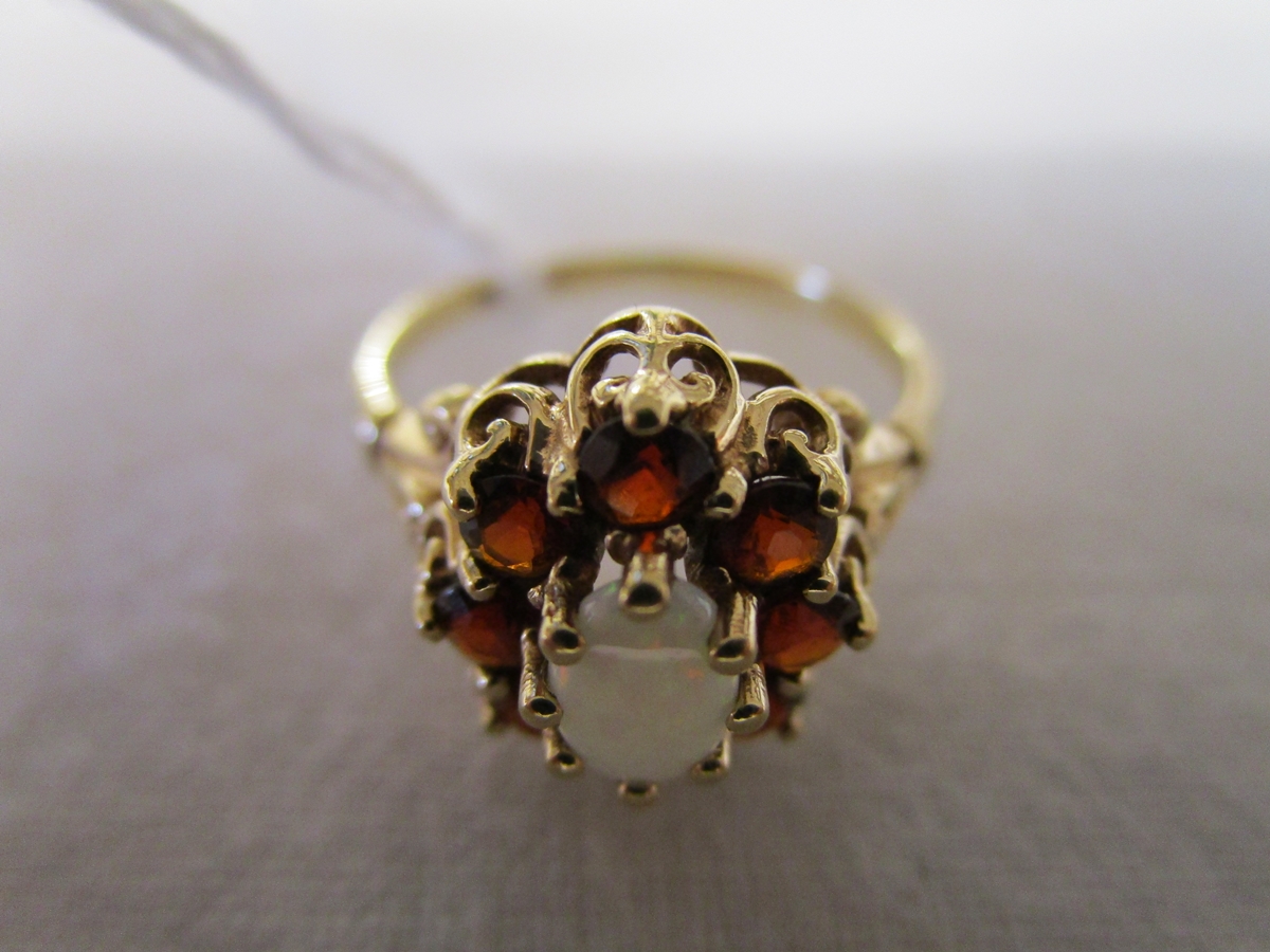 Gold opal & garnet ring