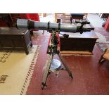 Astronomer's telescope with book etc