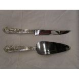 Silver handled cake knife and slice