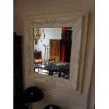 Bevelled mirror in painted white frame