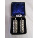 Boxed pair of silver powder shakers