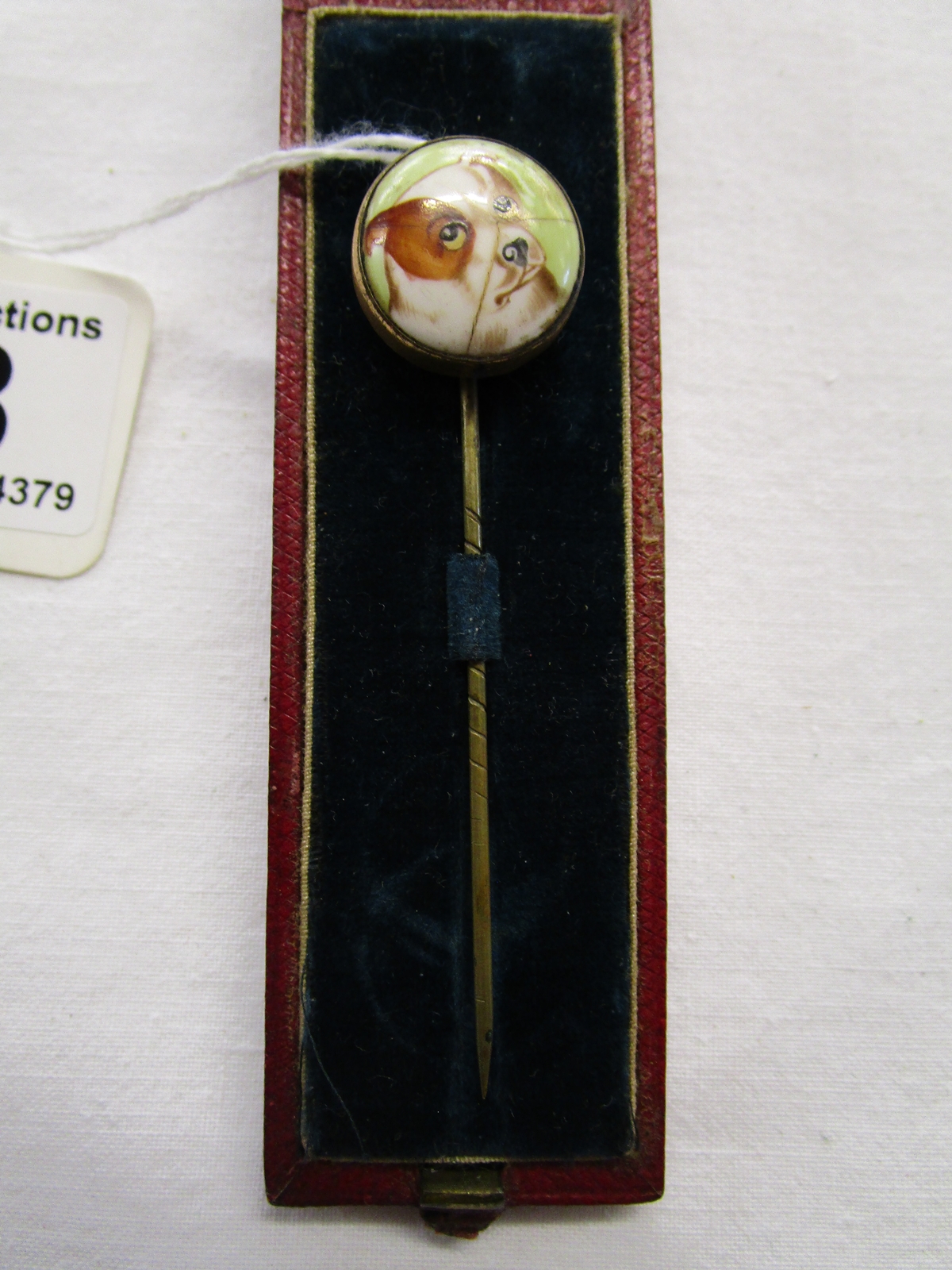 Cased dog themed tie pin