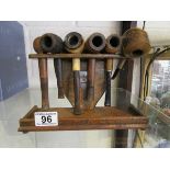 Collection of pipes on stand