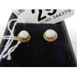 Pair of gold opal stud earrings