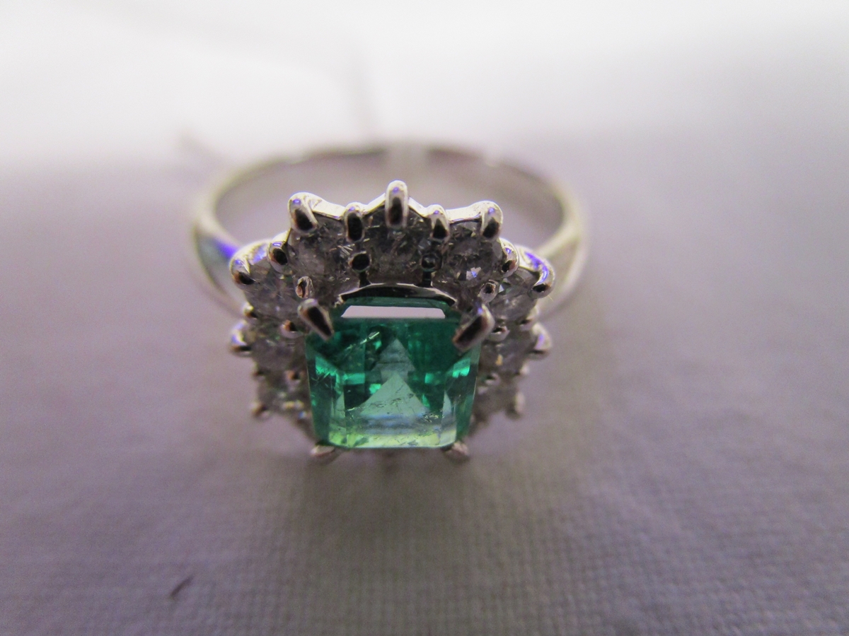 Fine platinum emerald cluster ring