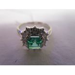 Fine platinum emerald cluster ring