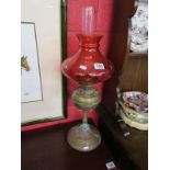 Brass oil lamp with cranberry shade