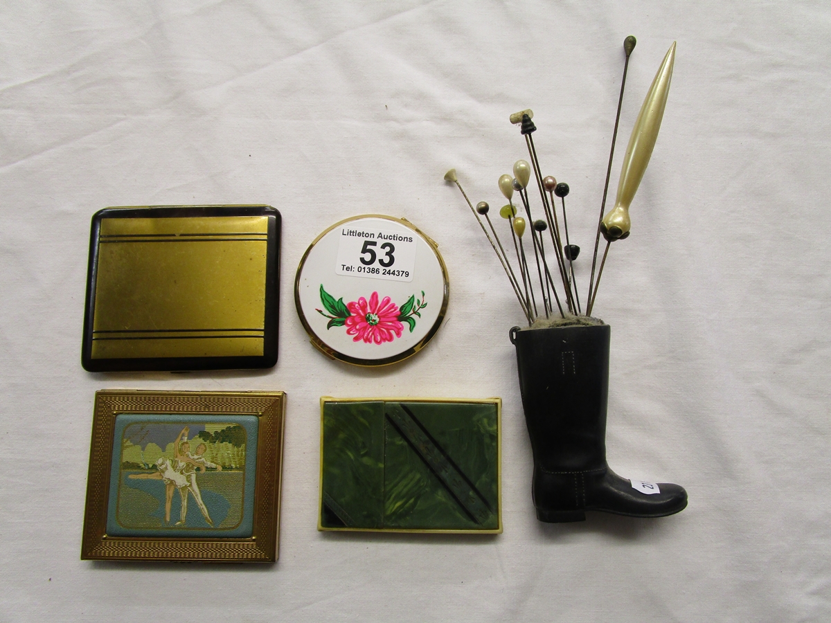 Collection of compacts and hat pins in stand