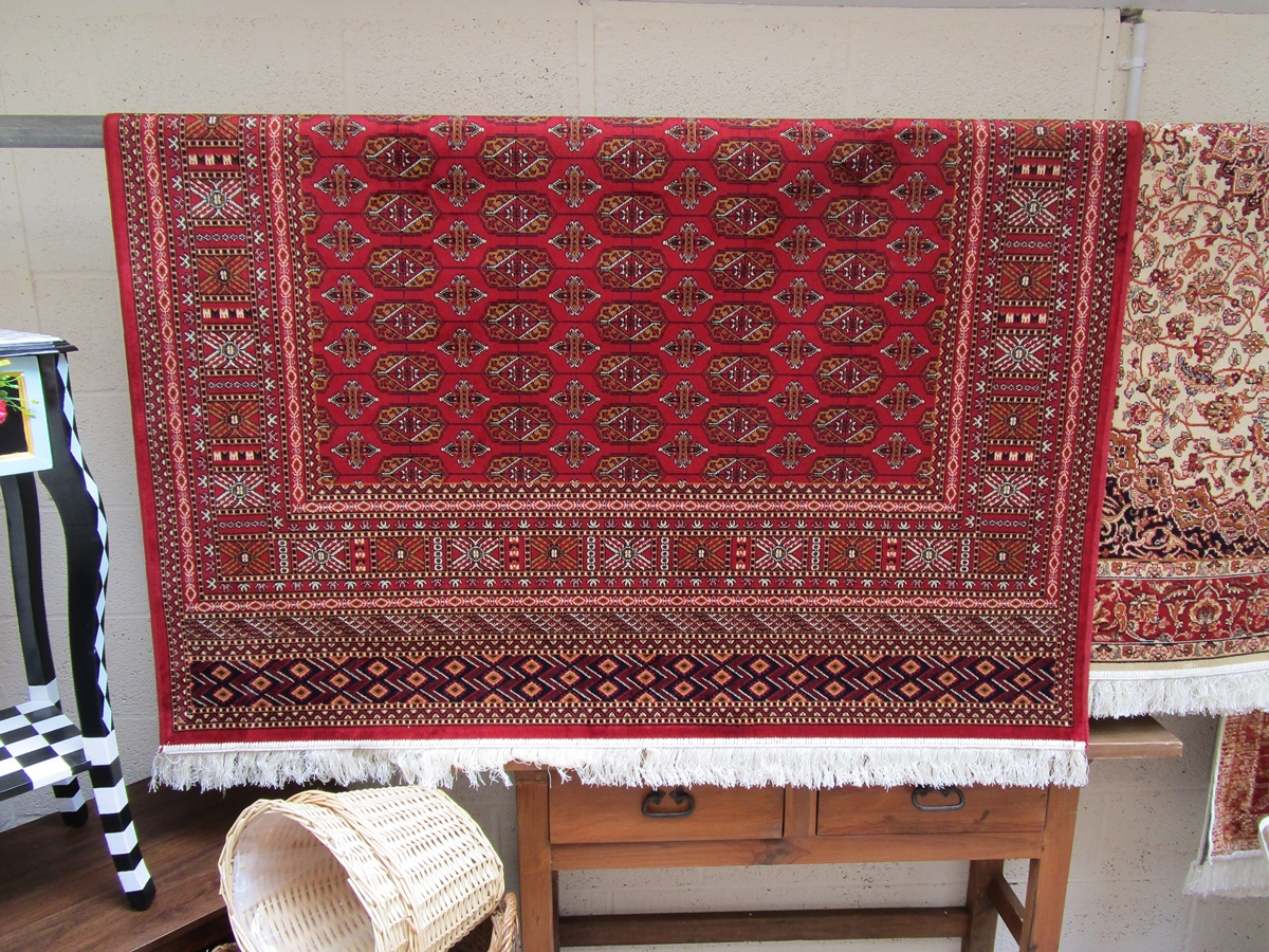 Red ground Bokhara carpet (approx 2.3m x 1.6m)